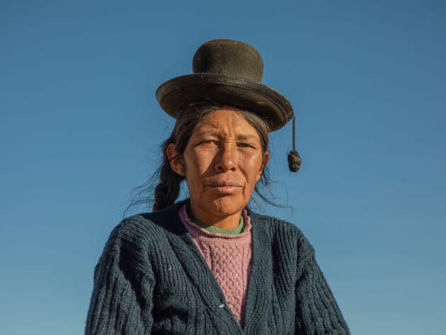 Woman wearing hat.